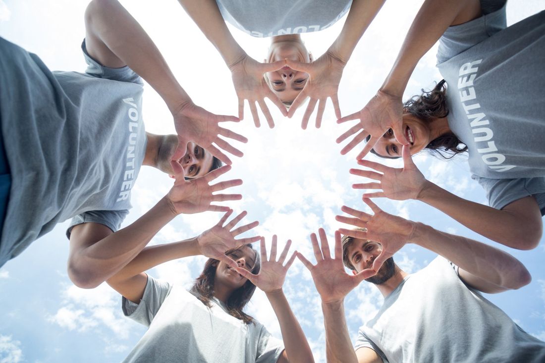 Many hands joined together