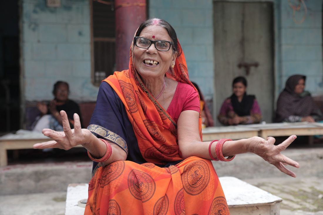 A Tisser artisan laughing